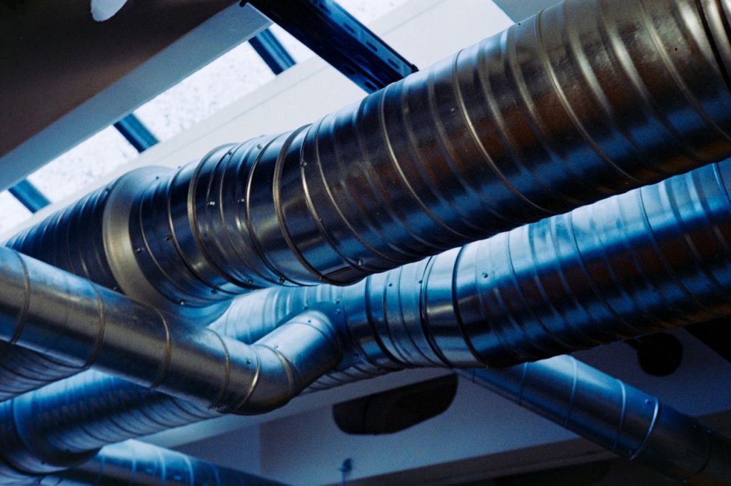 Crafting Captivating Headlines: Your awesome post title goes here Close-up of a modern metallic ventilation system in an industrial setting.